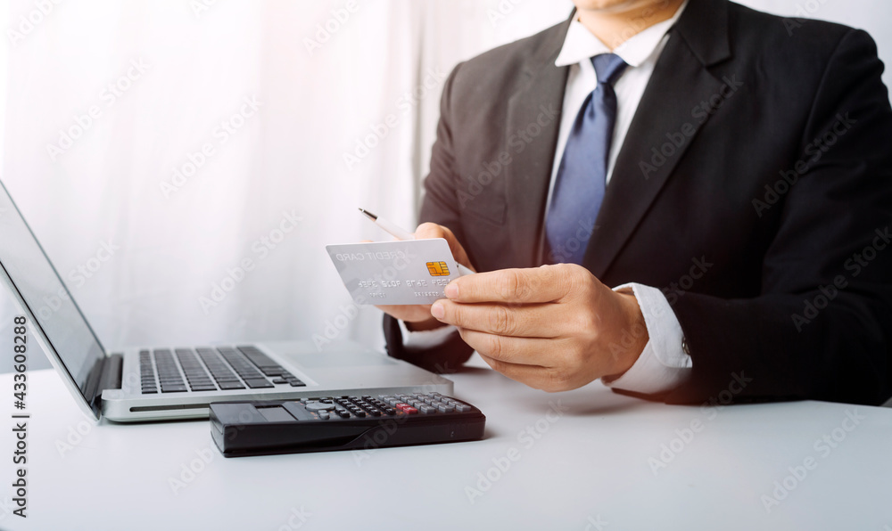 shopping online payment by using laptop.hands holding credit card and using laptop. online shopping concept. shopping online payment by using laptop.hands holding credit card and using laptop. online shopping concept.