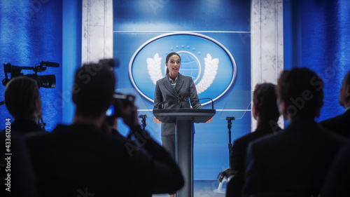 Photos Organization Female Representative Speaking at a Press Conference in Government Building
