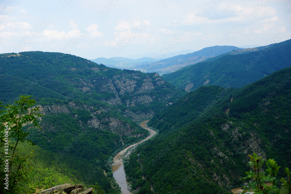 River flowing between mountains River flowing between mountains