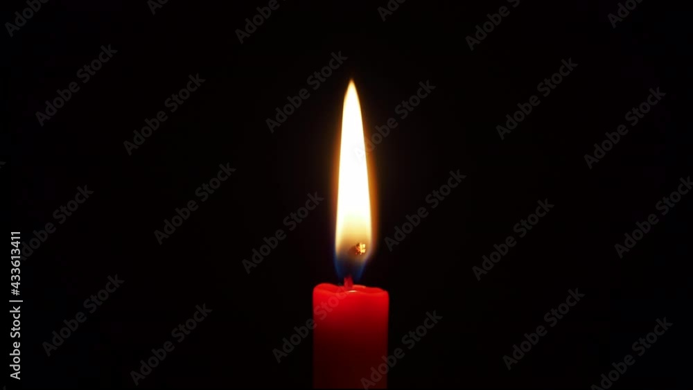 red candle on black background red candle on black background