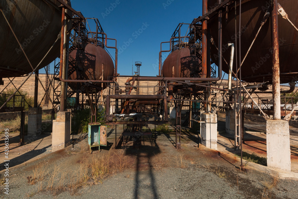 abandoned factory with rusty cisterns abandoned factory with rusty cisterns