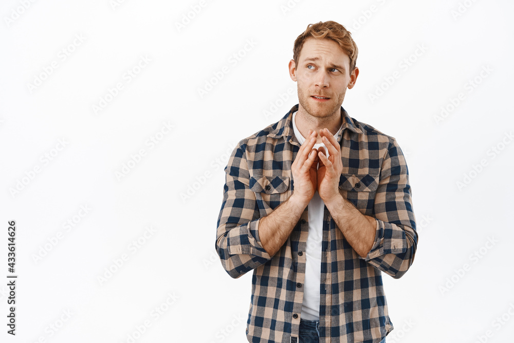 Image of thoughtful redhead man making plan, looking aside while steeple fingers like evil genius, thinking, scheming, having an interesting idea, white background Image of thoughtful redhead man making plan, looking aside while steeple fingers like evil genius, thinking, scheming, having an interesting idea, white background