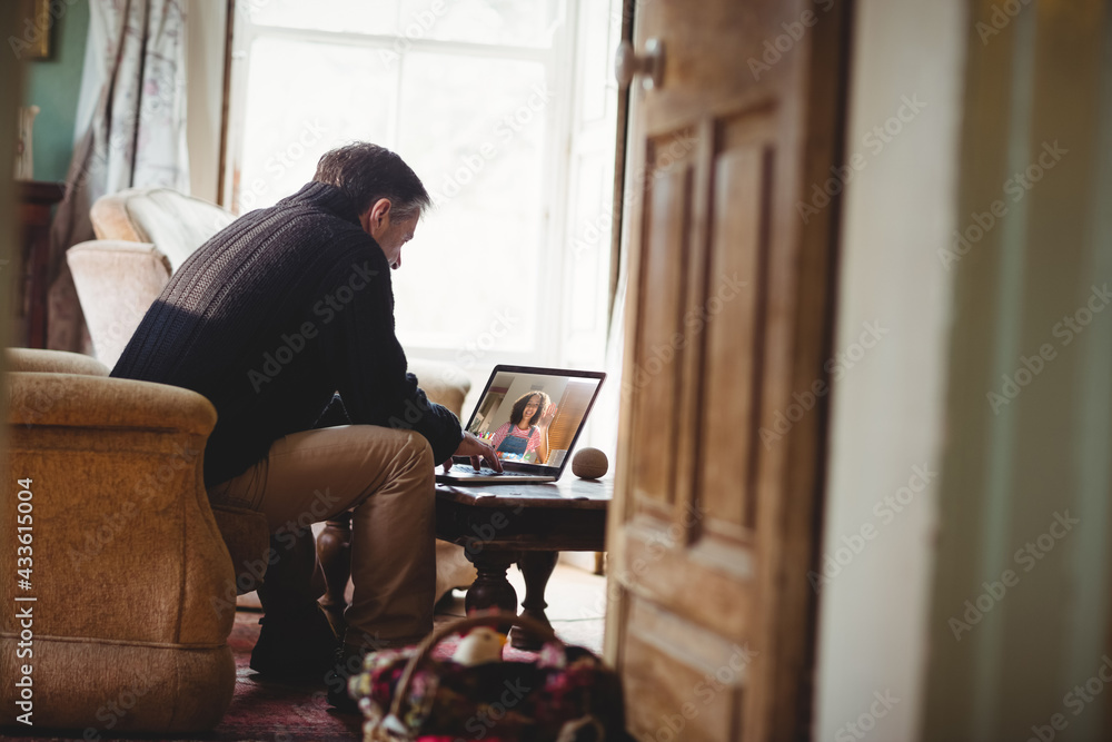 Senior caucasian man using laptop and having video call Senior caucasian man using laptop and having video call
