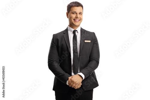 Принти на полотні Young elegant man with a name tag on his suit smiling at camera