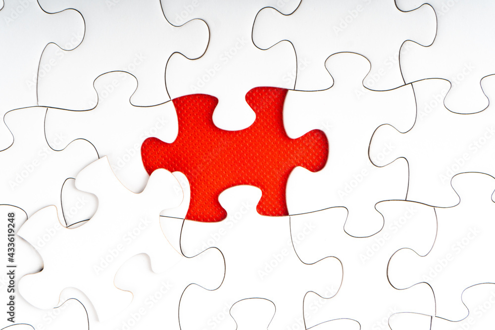 Red jigsaw puzzle pieces on red background. Copy space and business concept Red jigsaw puzzle pieces on red background. Copy space and business concept