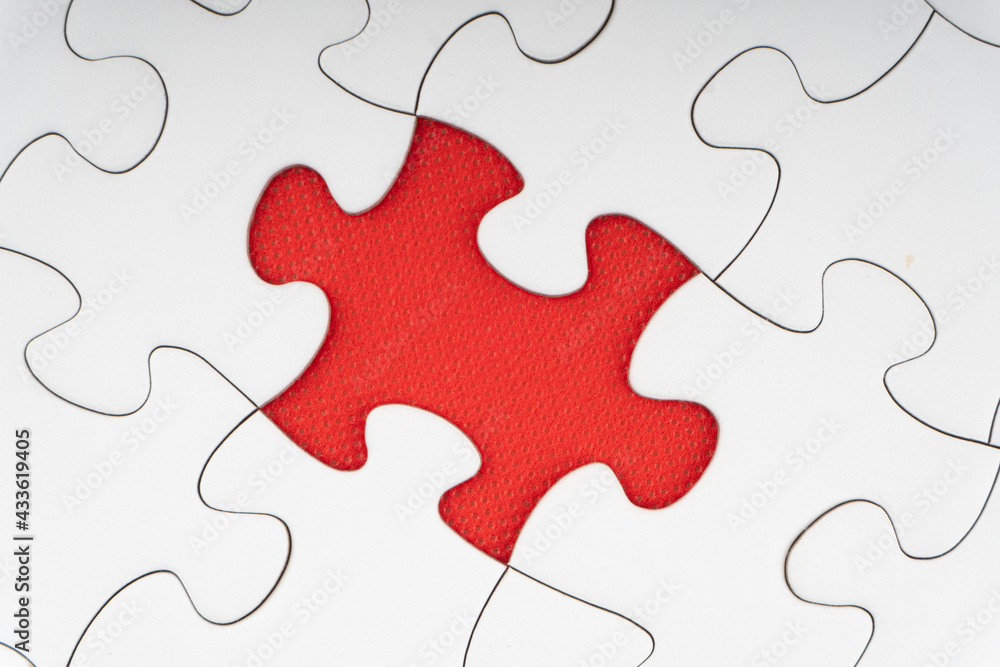 Red jigsaw puzzle pieces on red background. Copy space and business concept Red jigsaw puzzle pieces on red background. Copy space and business concept