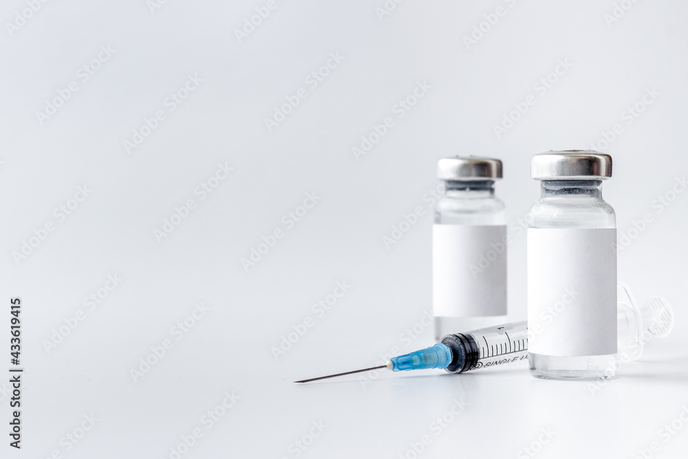 Vaccination with Covid vaccine in bottles with syringe Vaccination with Covid vaccine in bottles with syringe