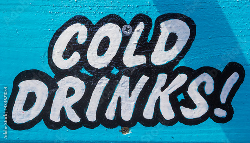 Wooden sign advertising cold drinks