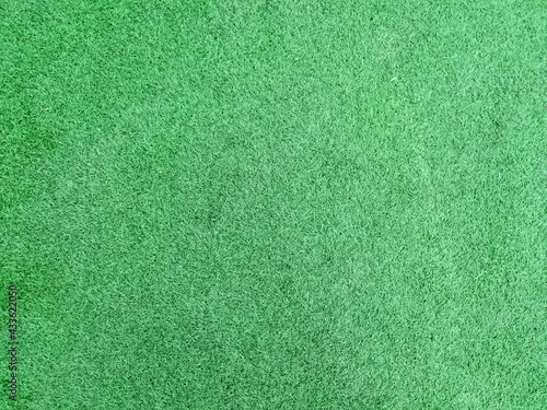 Lush artificial turf in football field top view