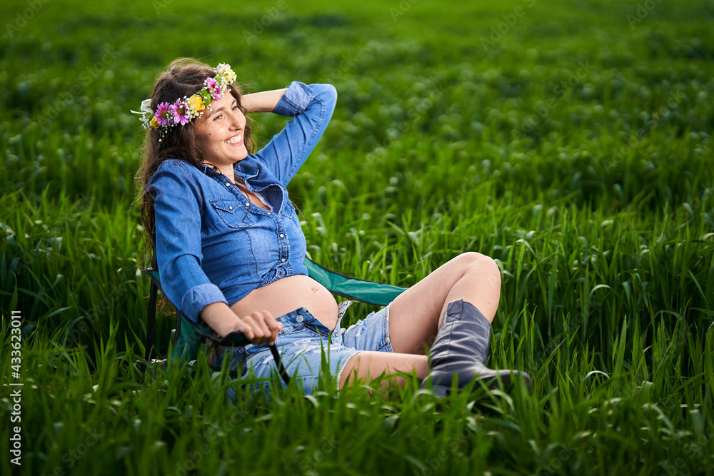 Pregnant woman in a wheat field