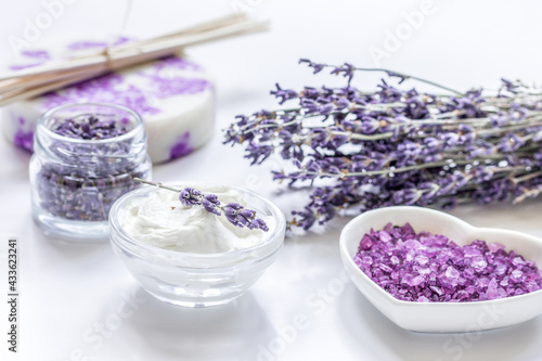 natural herb cosmetic with lavender flowers flatlay on white background