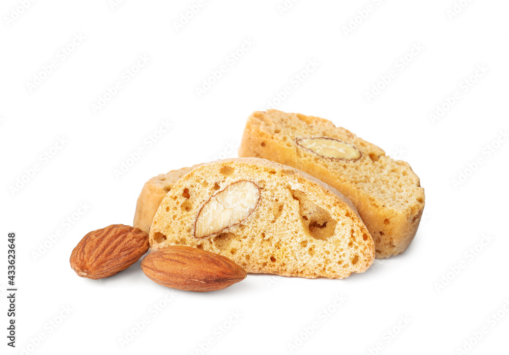 Slices of tasty cantucci and nuts on white background. Traditional Italian almond biscuits