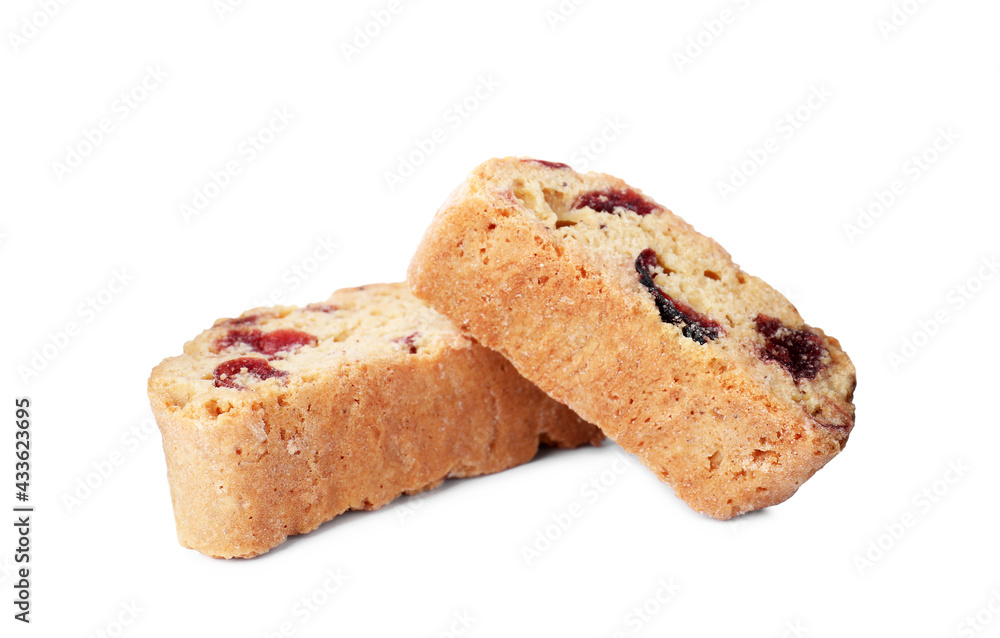 Slices of tasty cantucci with berry on white background. Traditional Italian almond biscuits