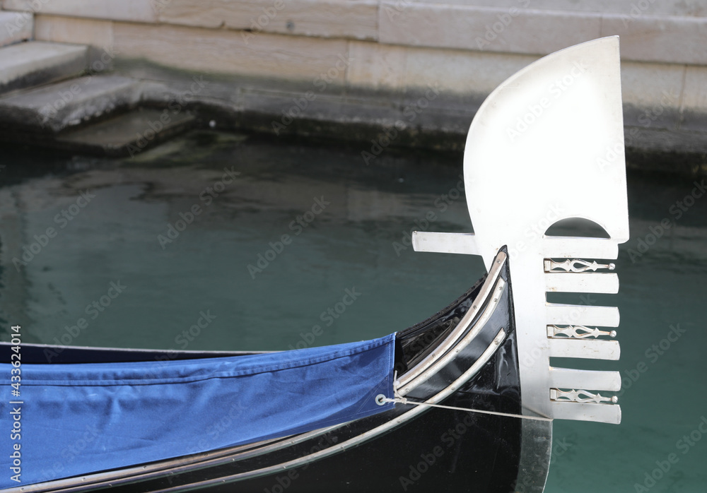 prow of the gondola with the characteristic shape that symbolizes the districts of the island of Venice