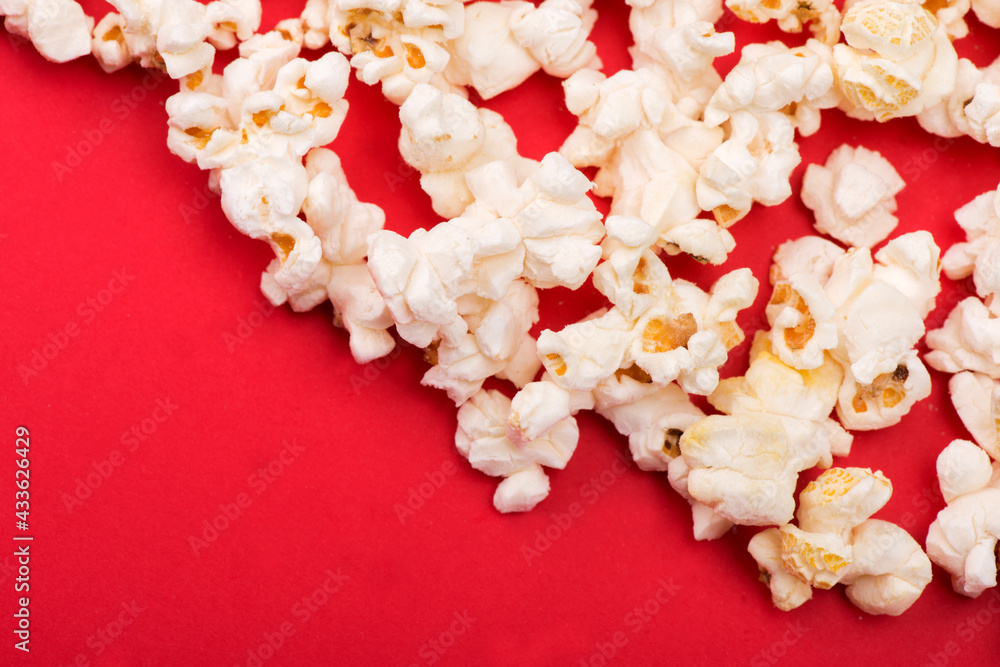 Heap of delicious popcorn isolated on background. Scattered popcorn texture background. Selective focus. Heap of delicious popcorn isolated on background. Scattered popcorn texture background. Selective focus.