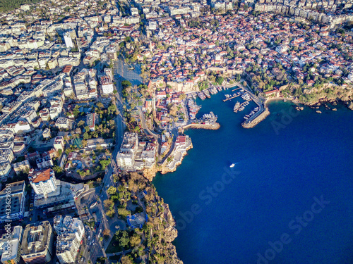 Aerial photograph of Antalya bay in Antalya city from high point of drone fly on sunny day in in Turkey. Wonderful view on the bay full of yachts and boat and with ancient old castle