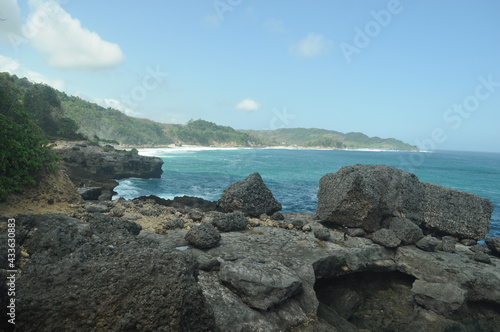 Beautiful scenery on Kedung Tumpang beach with large rocks, Pucanglaban District, Tulungagung Regency, East Java