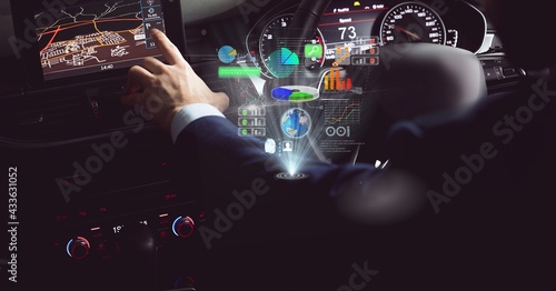 Composition of data processing on interactive screen over businessman using navigation driving car
