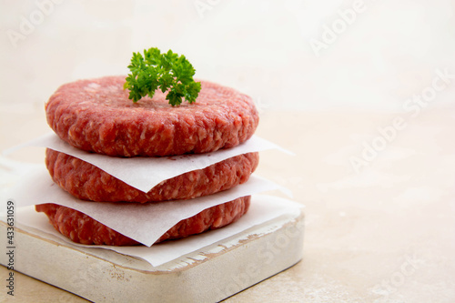 Raw minced meat for burgers. Cooking homemade burgers. photo