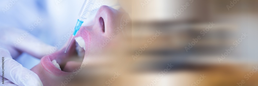 Composition of close up of female patient receiving local anaesthetics with blurred light trails Composition of close up of female patient receiving local anaesthetics with blurred light trails