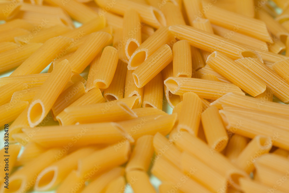 Penne pasta background. Pasta Penne texture background. Penne pasta background. Pasta Penne texture background.