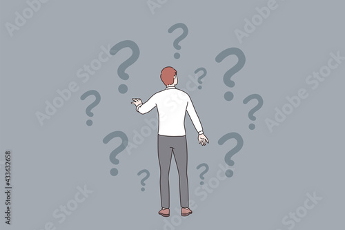 Doubt, question, uncertain concept. Young frustrated businessman standing backwards and feeling doubt with question signs above vector illustration 