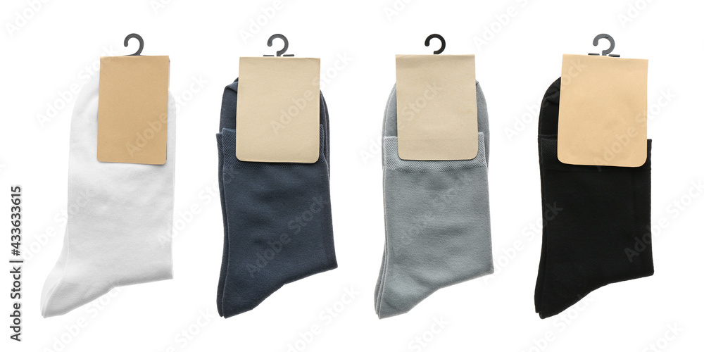 Pairs of cotton socks with blank labels on white background, collage ...