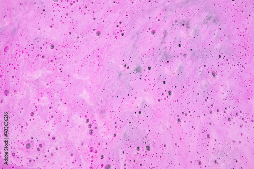 pink foam textured effect background on asphalt, abstract background, full frame