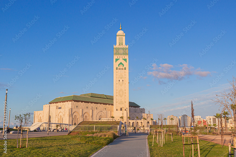 Landscaped recreation area in front of the Hassan II mosque at sunny evening in Casablanca, Morocco