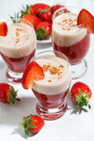 sweet strawberry yoghurt milkshake in glasses, vertical