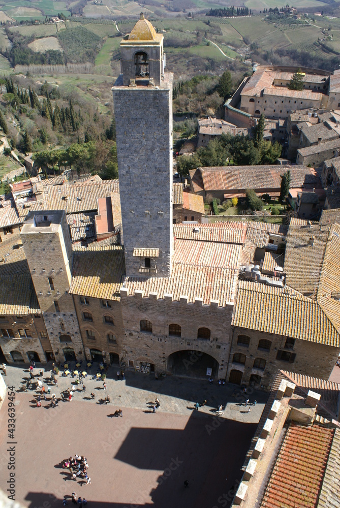 Aerial view of San Gimignano in Tuscany (Italy): piazza Duomo and Palazzo Vecchio del Podestà with Torre Grossa
