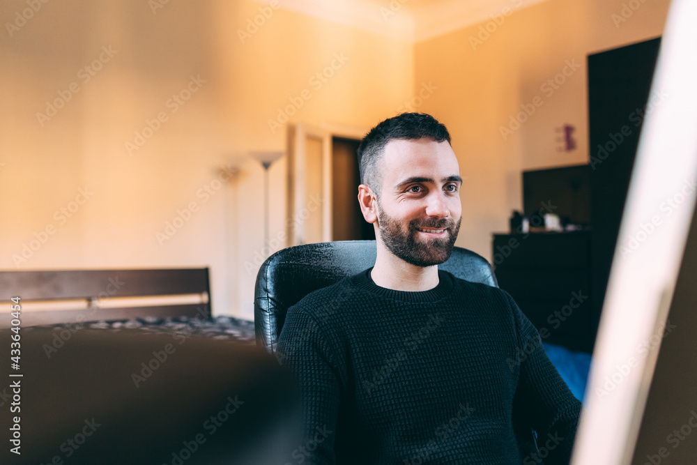 young man bearded indoor using computer young man bearded indoor using computer