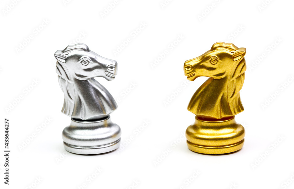 Knight horse chess pieces gold and silver isolated on white background. Stock Photo Adobe Stock