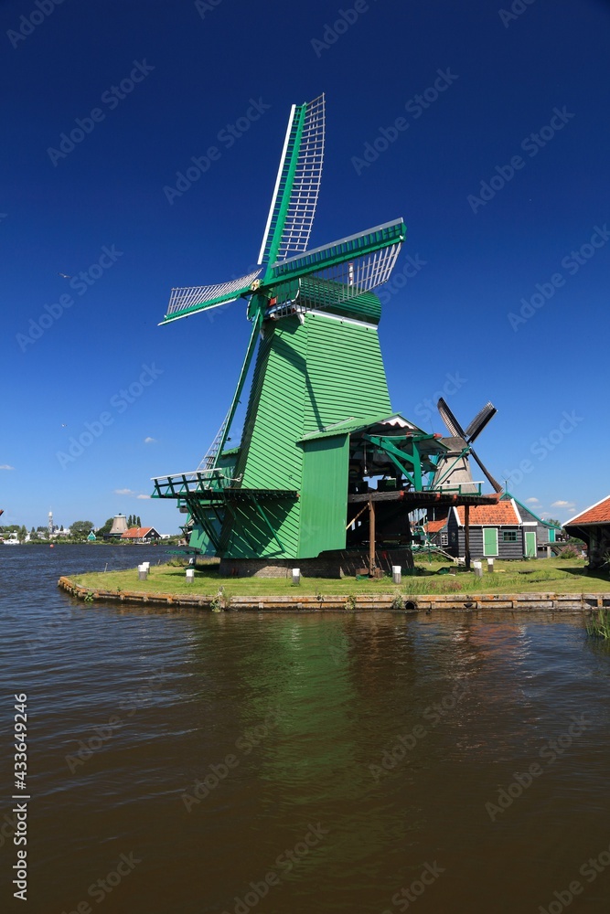Fototapeta premium Zaanse Schans - Dutch windmill. Summer photo in the Netherlands. Landmarks of the Netherlands.