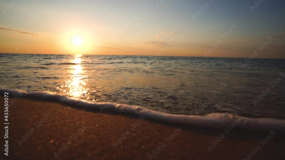 Magic morning on the beach. Ocean sunrise and waves on the sand. Magic morning on the beach. Ocean sunrise and waves on the sand.