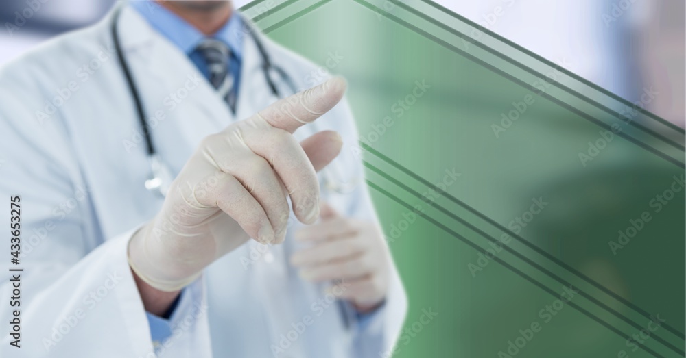 Composition of midsection of male doctor wearing surgical gloves touching interactive screen Composition of midsection of male doctor wearing surgical gloves touching interactive screen