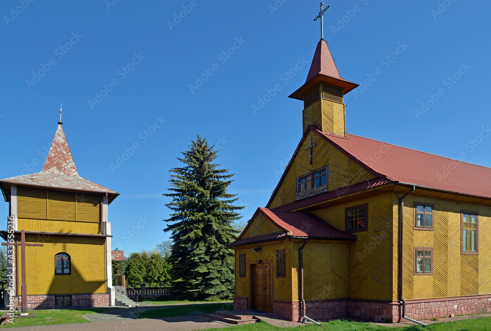 Fototapeta premium The belfry was built in the seventies of the 20th century at the Catholic Church of the Exaltation of the Holy Cross in the town of Platerów in Mazovia, Poland.