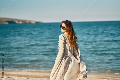 woman tourism travel sea sand beach mountains fresh air relax