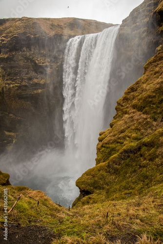 Skogafoss waterfall from the top in Iceland misty spraying atmospheric foggy