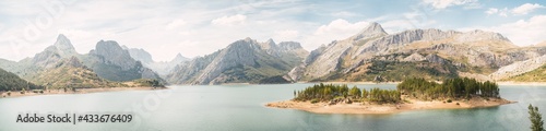 Nice landscape of a huge river surrounded by mountains on a cloudy day