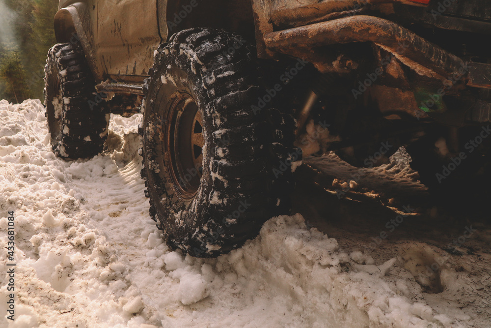 Dirty cars and wheels in the mountains. Swamp on the tires. Trips offroad across Ukraine. View of the Carpathian Mountains. Dirty cars and wheels in the mountains. Swamp on the tires. Trips offroad across Ukraine. View of the Carpathian Mountains.