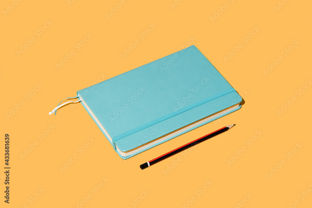 Vector illustration of notepad bookmark and pencil for taking notes on bright orange background Vector illustration of notepad bookmark and pencil for taking notes on bright orange background