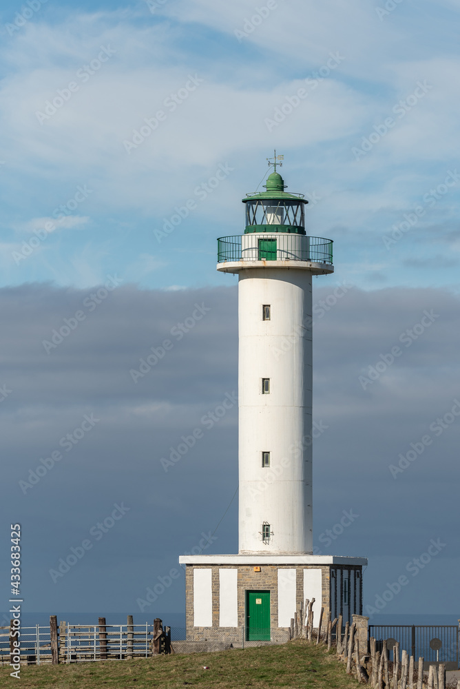 White lighthouse placed in Faro de Lastres in Asturias in Spain under cloudless blue sky in daytime White lighthouse placed in Faro de Lastres in Asturias in Spain under cloudless blue sky in daytime