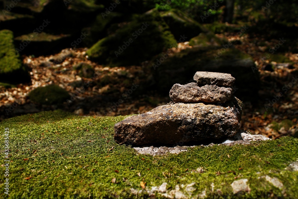 moss on stone and some stacked stones with moss moss on stone and some stacked stones with moss