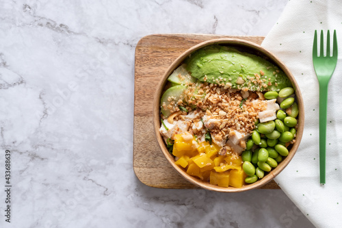 From above of delicious homemade poke served on wooden board on table photo