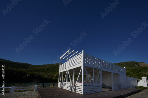wooden structure under a cafe on the lake