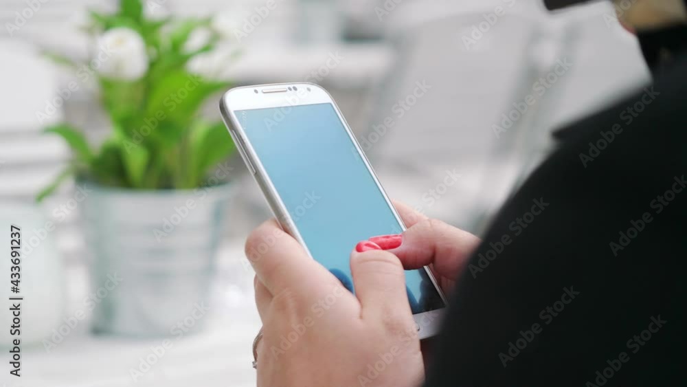 Woman writes a message on the cell phone in 4k slow motion 60fps Woman writes a message on the cell phone in 4k slow motion 60fps