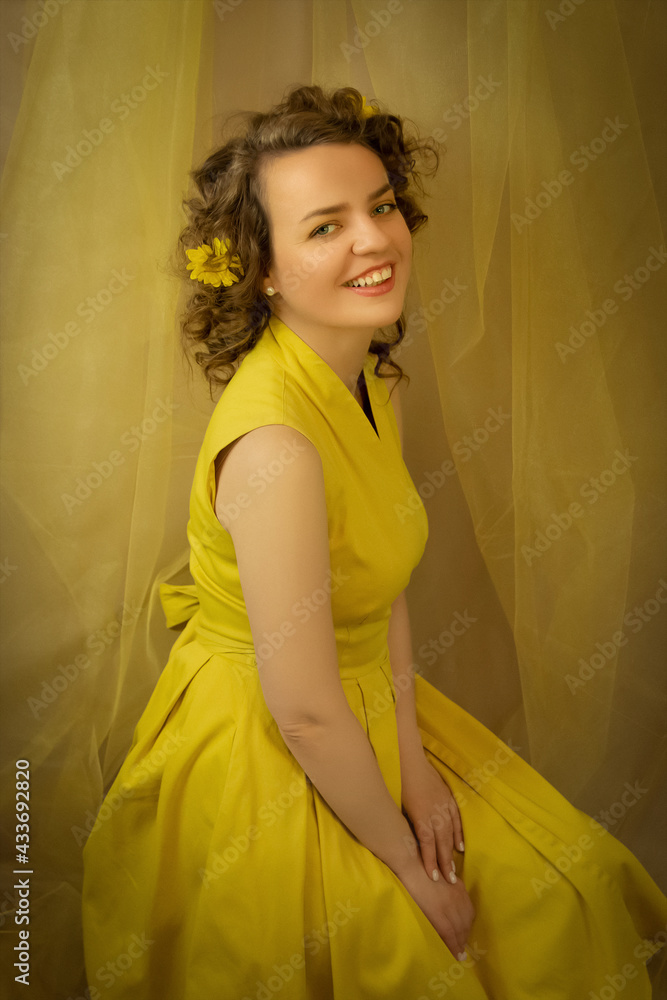 Bright sunshine lady in yellow dress with yellow flowers closeup.Art processing.