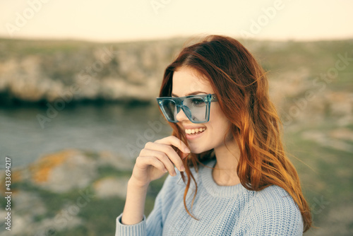 cute red-haired woman wearing glasses outdoors fresh air travel © SHOTPRIME STUDIO