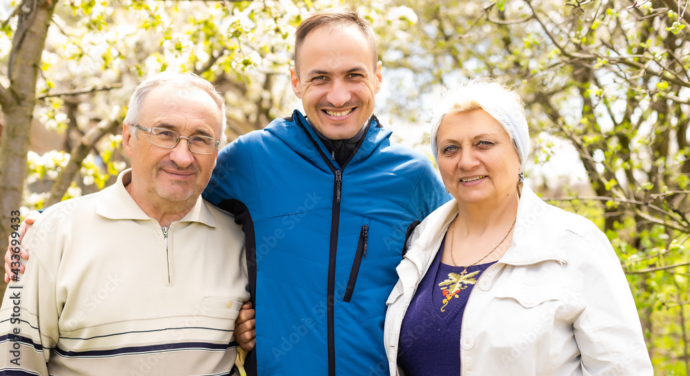 Portrait Of Family With Adult Son outdoors. Portrait Of Family With Adult Son outdoors.